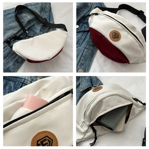 Detail view of Oxford fabric sling bag showing multi-compartment interior and logo