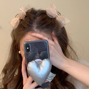 Pair of champagne mesh bow hair claws for women, elegant side clips in soft organza