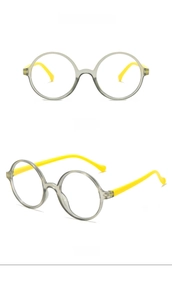 Detail of round kids' glasses frames in gray and bright yellow with side and front views