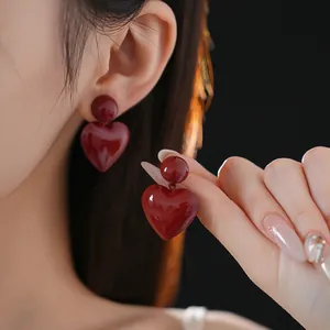 Minimalist burgundy heart drop earrings featuring a glossy finish for a stylish look