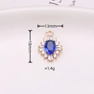 Gold-plated sunburst oval pendant with blue sapphire cubic zirconia and sparkling diamonds