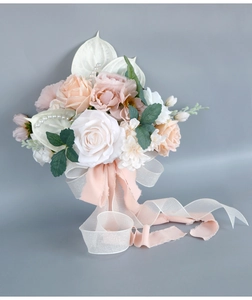 Detail of bridal bouquet with pink roses, white anthuriums, and organza pearl tassels