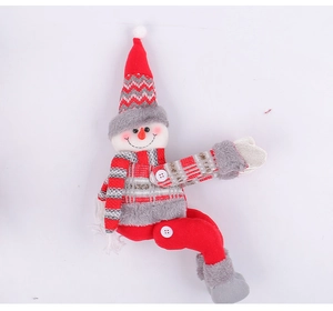 Detailed view of handmade Christmas snowman doll with red knitting and movable joints