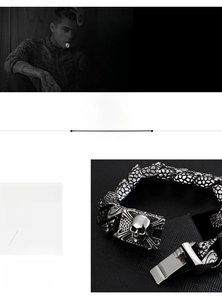 Detail of 316L stainless steel skull bracelet with vintage punk scale texture