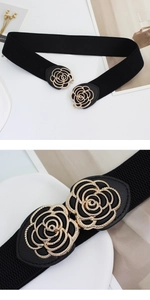 Macro detail of golden flower buckle on black elastic waist belt for elegant dresses