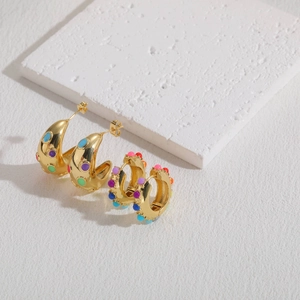 Bohemian 14K gold plated hoop earrings with colorful beads on a white stone background