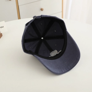Interior view of navy blue kids baseball cap with reinforced six-panel cotton stitching
