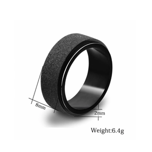 Detail shot of 8mm black spinner ring with sandblasted finish and polished edges