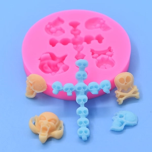 Halloween silicone mold featuring skulls and crosses for DIY cake baking and crafts