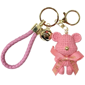 Pink resin teddy bear keychain with gold bell and woven strap for handbag charms