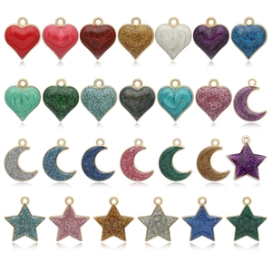 Colorful glitter enamel alloy heart star and moon charm pendants set on white background