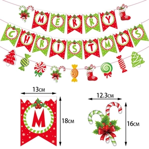Red and green Merry Christmas banner with candy and sock decorations for holiday parties