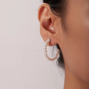 Elegant 18K gold stainless steel C-shaped pearl stud earrings for women on model