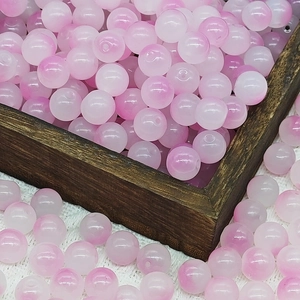 Detailed view of 8mm pink and white gradient glass beads for DIY jewelry making