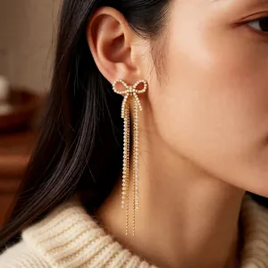 Elegant 18k gold plated bow tassel earrings with sparkling zircon crystals