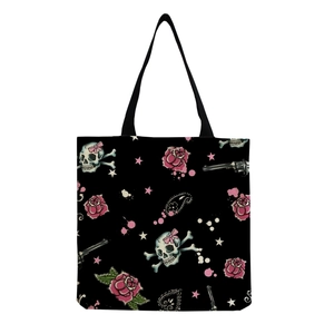 Detail of canvas tote bag with gothic skull rose print and black shoulder handles