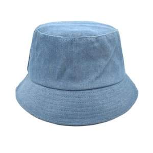 Detailed view of light blue denim bucket hat showing washed fabric texture and stitching