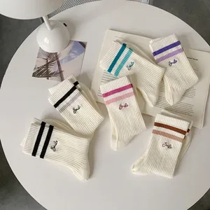 Five pairs of breathable mid-calf sports socks with double stripes and Smile text