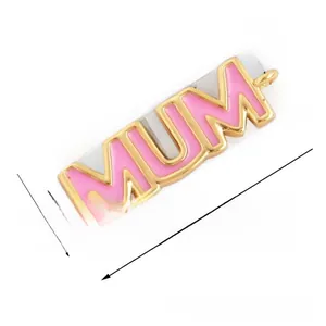 Detail of MUM letter connector with pink enamel and gold plating for DIY jewelry making