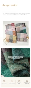 Close-up of soft imitation cashmere plaid scarf showing fringe details and fabric texture