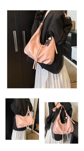 Detailed views of a pink hobo bag with drawstring and cute monkey pendant accessory