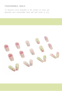 Detail of coffin press-on nails featuring green gradient and red ripple art designs