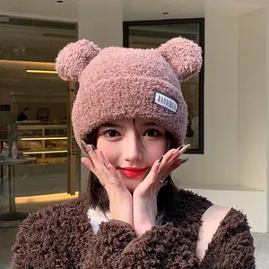 Cute teddy plush beanie with bear ears and woven label in dusty pink for winter warmth