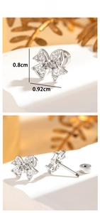 Macro detail of zircon butterfly ear studs with screw back design and 0.92cm size