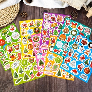 Close-up of waterproof laser Christmas stickers featuring Santa and reindeer on wood