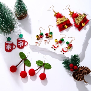 Collection of festive Christmas drop earrings featuring Santa, reindeer, and snowflakes