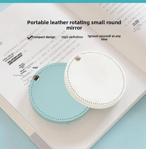 Detail of swivel PU leather portable mini makeup mirrors in white and blue colors