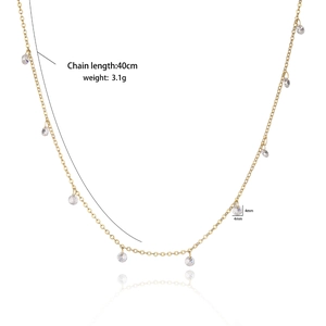 Detailed view of gold necklace showing 40cm chain length and 4mm zircon charm weight