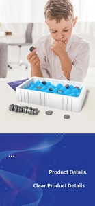Close-up of child playing magnetic chess with blue wave sponge board and black stones