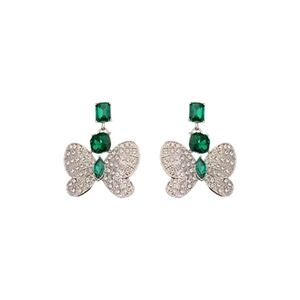 Silver needle butterfly earrings with emerald green gemstones and sparkling rhinestones