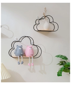 Cloud-shaped wall shelf detail with black iron frame and wood base holding teddy bears