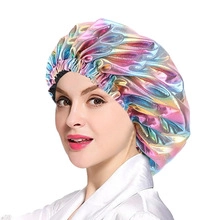 Macro detail of holographic satin sleeping cap with ruffled edges and metallic gloss