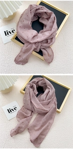 Close-up of semi-circle dusty pink cotton linen scarf with polka dots and wavy lace edge