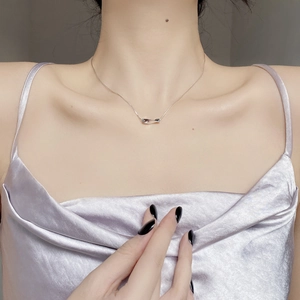 Minimalist 925 sterling silver necklace with twisted bar pendant on female model