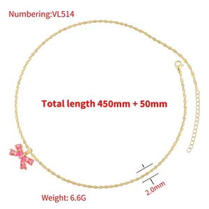 Golden wave chain necklace with pink enamel bow pendant and white zircon details