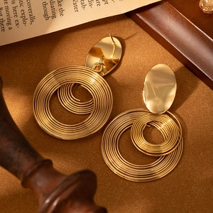 Elegant gold layered geometric hoop earrings in a minimalist circular tiered design
