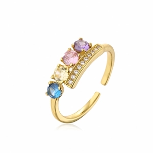 Detail of gold-plated open ring featuring colorful cubic zirconia and micro-pave setting