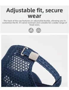 Detail of adjustable metal buckle and mesh fabric on navy blue baseball cap back
