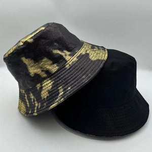 Detail view of two unisex street style bucket hats showing premium stitching and fabric texture