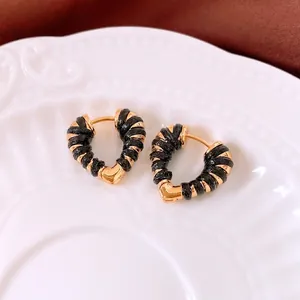 18k gold heart-shaped hoop earrings with textured black wrap detailing for women