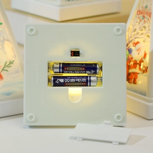 Detail view of the battery compartment and on-off switch on the Christmas lantern base