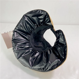 Women's wide brim sun hat with glossy black finish and beige lining, ponytail friendly design