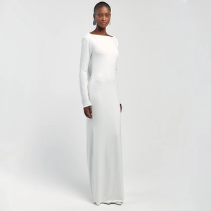 Detail shot of the long-sleeved white slim fit maxi dress on a professional model