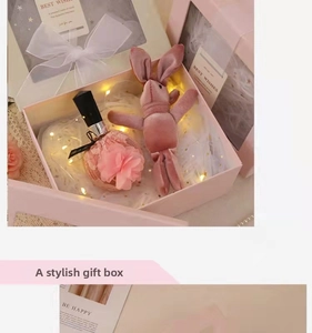Pink gift box set with perfume bottle, velvet rabbit plush, and LED warm fairy lights