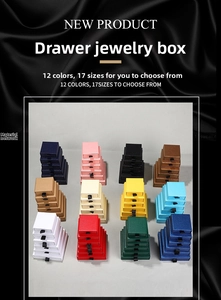 Macro view of multi-color drawer-style jewelry boxes in various sizes for ring storage
