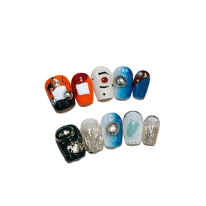 Handmade orange sea short press-on nails with blue gradient and gold foil artistic design